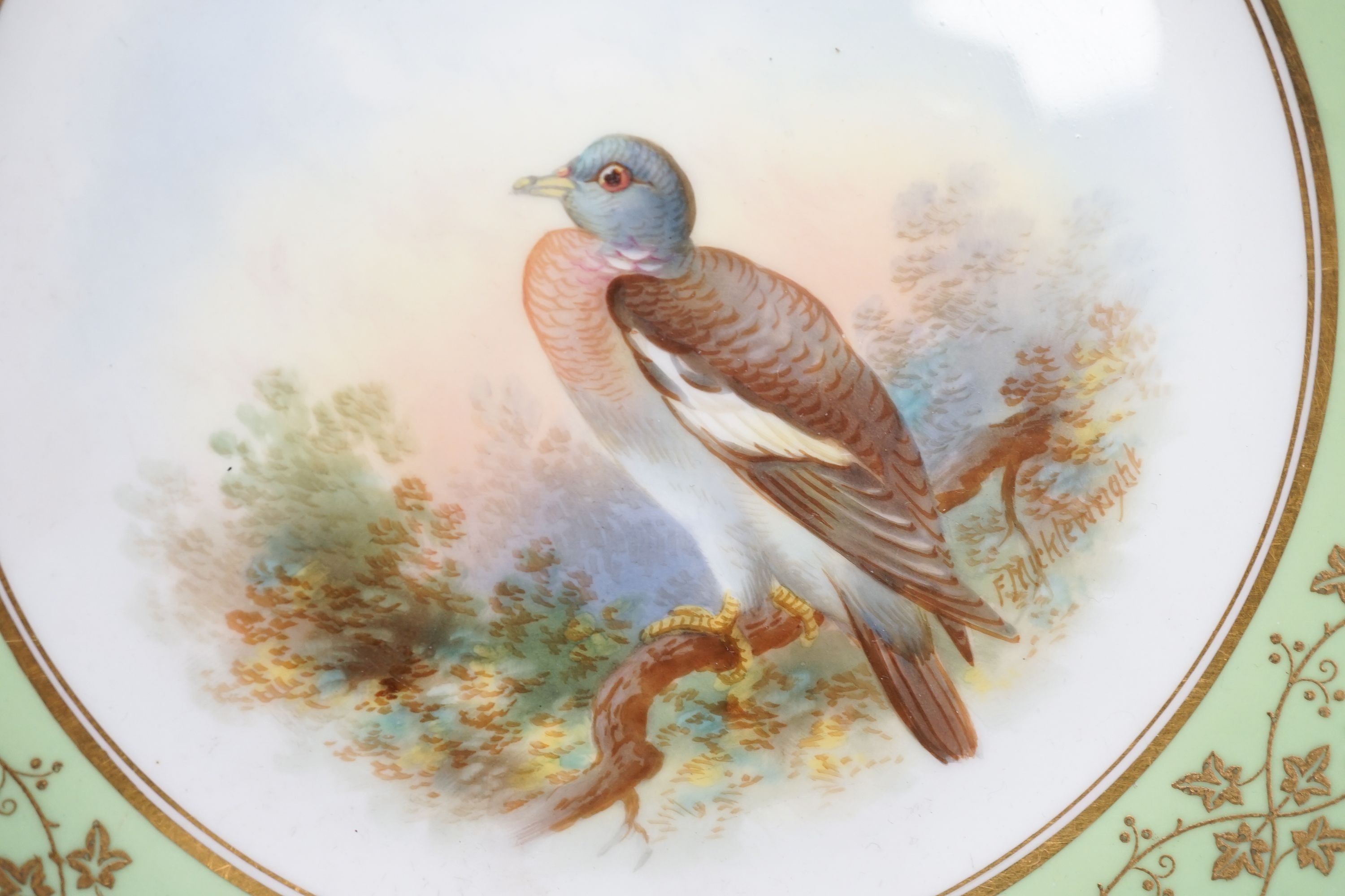 A late 19th century Aynsley pair of plates painted by F. Micklewright each signed, with a Widgeon or Wood Pigeon named verso 22cm